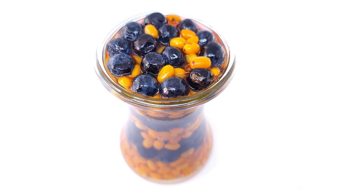 Sea buckthorn and sloes berries macerated in honey, photo 1