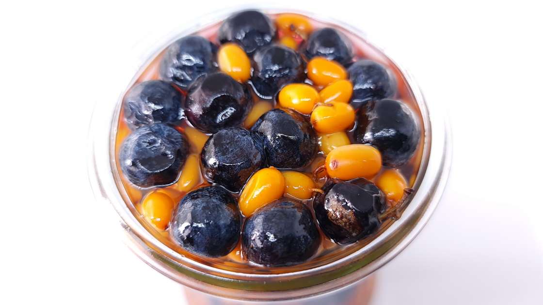 Sea buckthorn and sloes berries macerated in honey, photo 4
