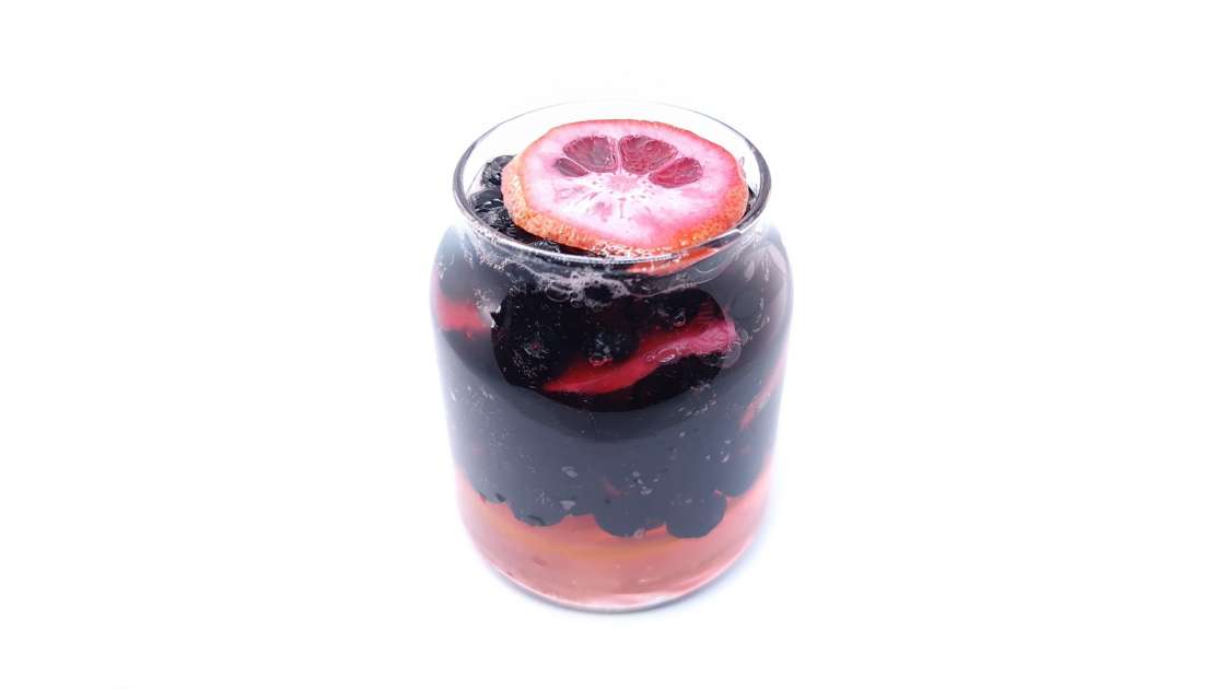 Aronia berries with lemon and ginger macerated in honey, in a jar, photo 4