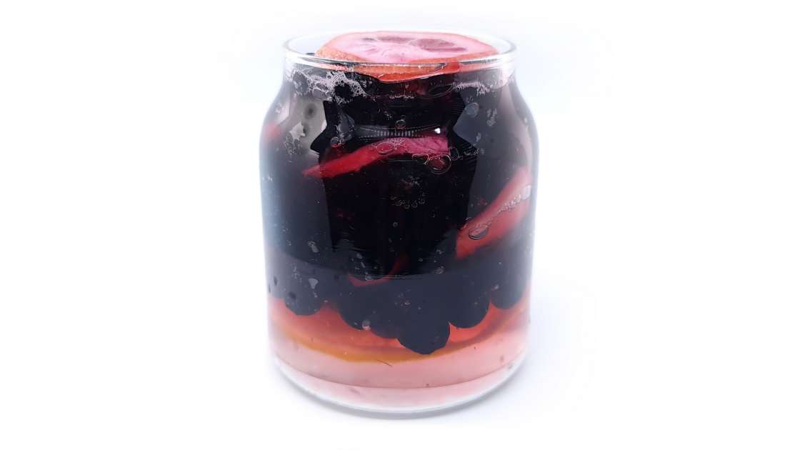 Aronia berries with lemon and ginger macerated in honey, in a jar, photo 5