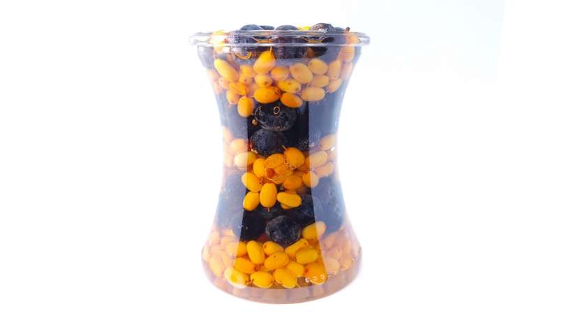 Sea buckthorn and sloes berries macerated in honey, photo 2