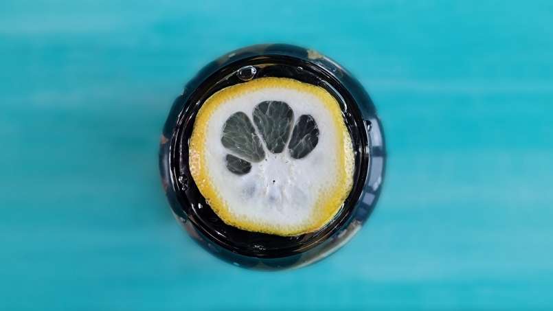 Aronia berries with lemon and ginger macerated in honey, in a jar, photo 3