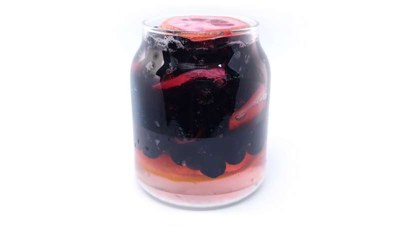 Aronia berries with lemon and ginger macerated in honey, in a jar, photo 5